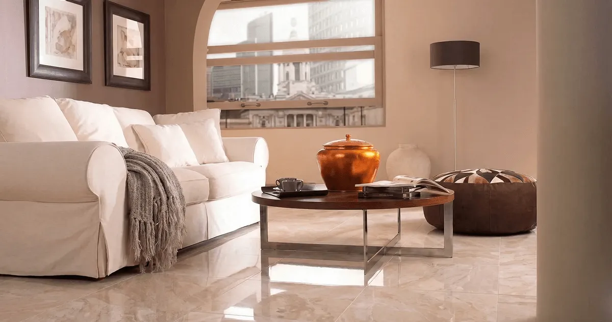 Modern living room with professionally installed marble flooring, a beige sofa, coffee table in Hollywood, FL
